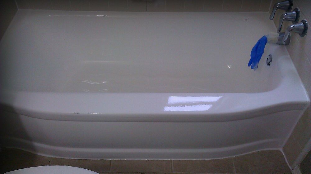 Bathtub after professional refinishing — glossy, factory-fresh white finish