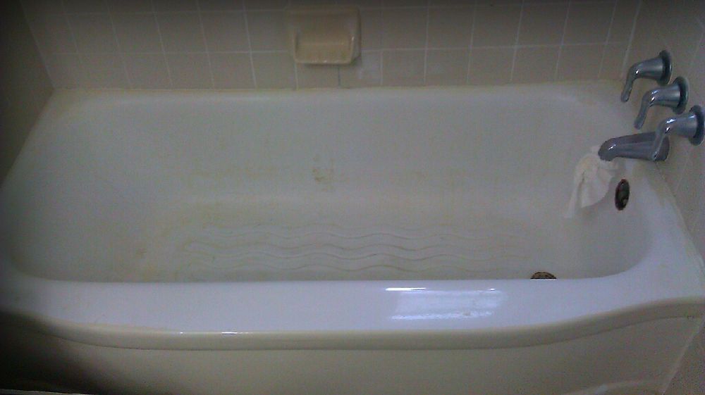 Bathtub during refinishing preparation and masking